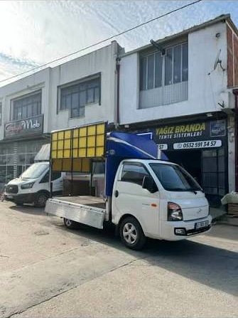 Açılır kanatlı tente